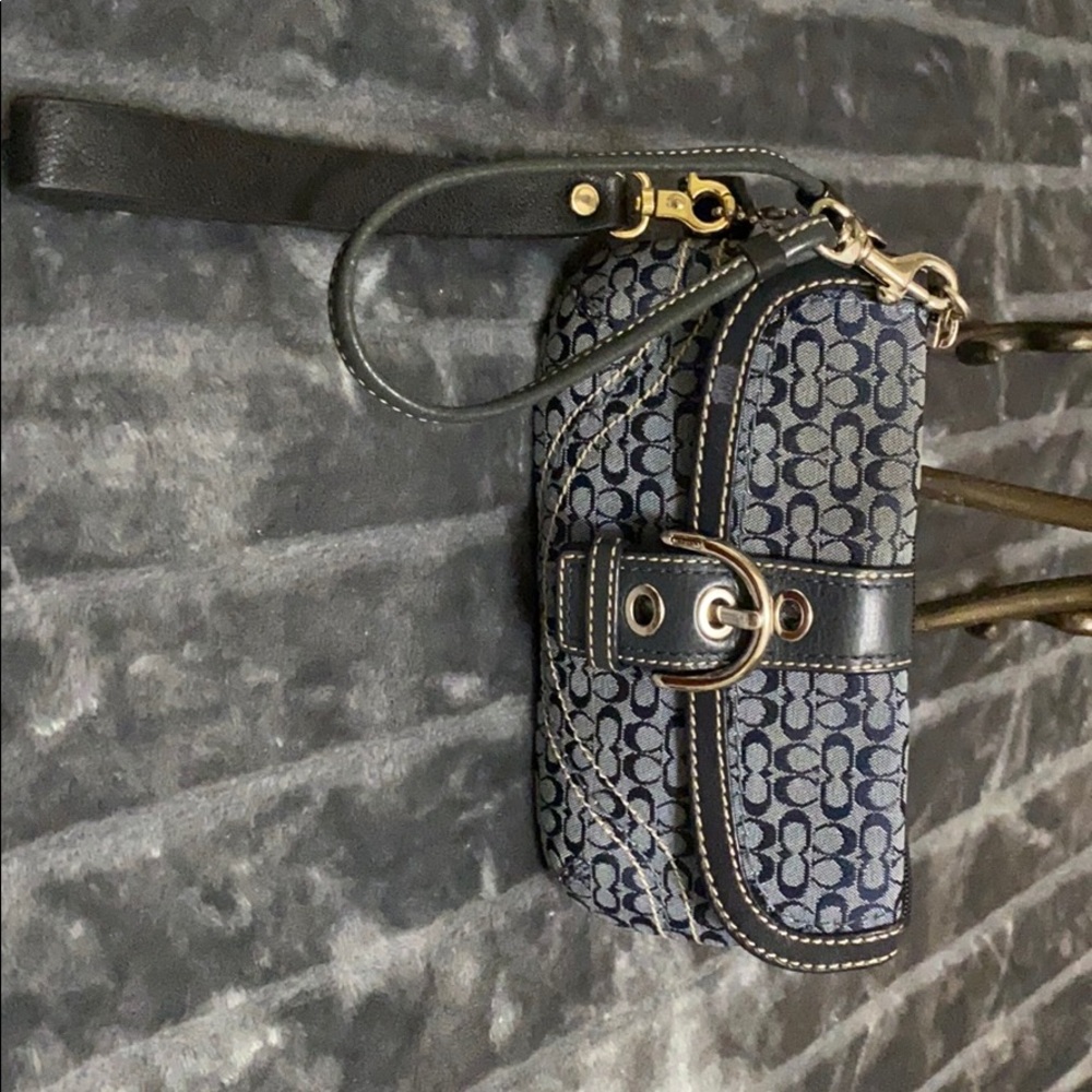 Coach monogram with leather trim wristlet